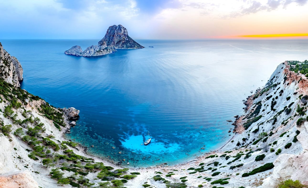 Amphitheater of Es Vedrà, fine art photograph by Bruno Boni. A long-exposure, ultra-high-resolution panorama of the Ibiza coast. The natural amphitheater of Cap Blanc shelters a…
