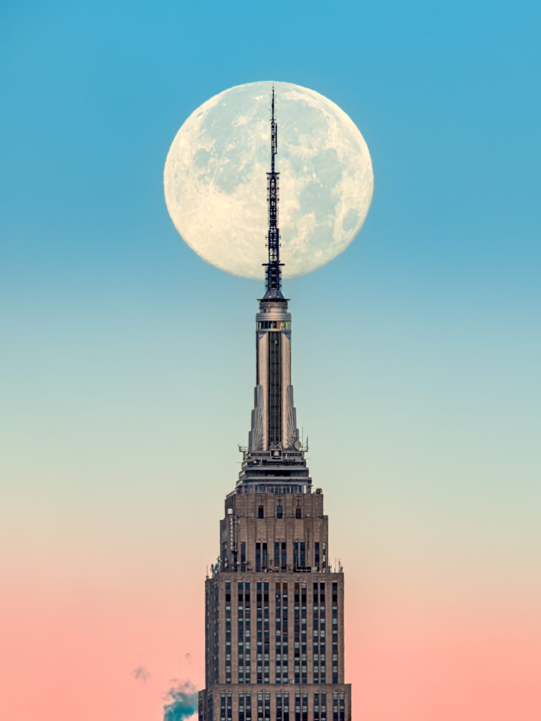 Supermoon ESB, fine art photograph by Bruno Boni. Photographed on December 4, 2025, this work shows the year's last supermoon aligned with the top of the Empire State…